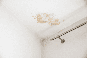 A ceiling with water damage is shown in a medium shot