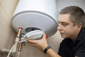 man working on a water heater