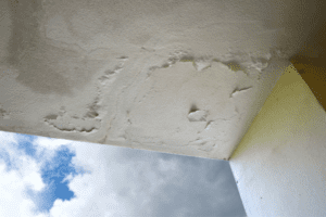 A ceiling with water damage