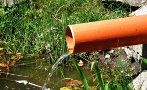 Water flowing from an orange pipe